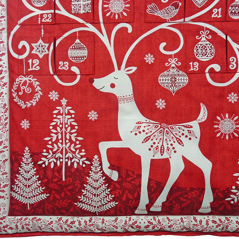 Handmade advent calendar stitching detail — fabric reindeer design by Vicki Evans