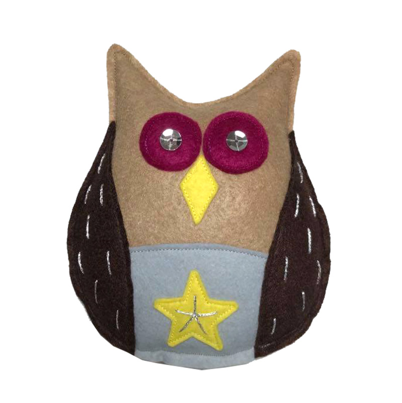 Handmade owl Christmas tree topper on tree — felt owl decoration by Vicki Evans