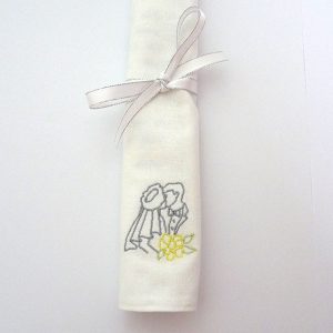 Rolled personalised wedding handkerchief tied with ribbon
